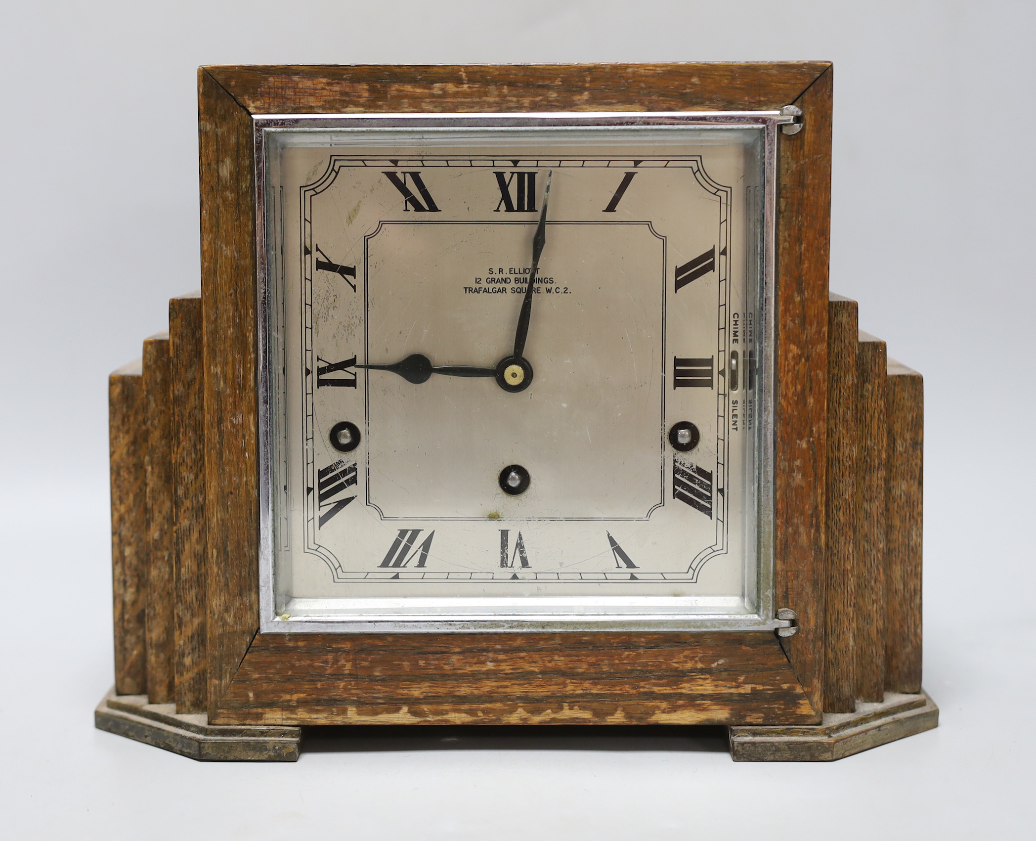 An Art Deco oak cased mantel clock by S R Elliot, 26cm wide